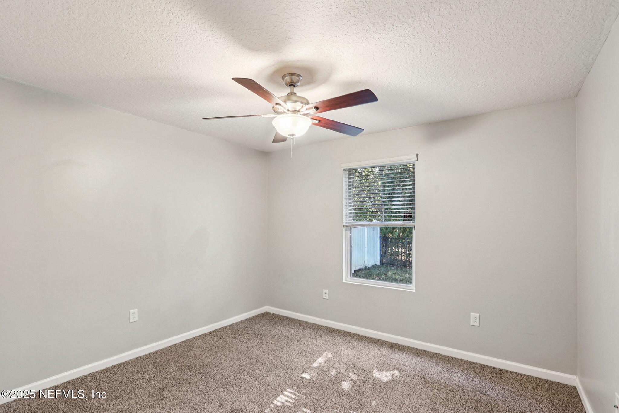 4054 Trail Ridge Road Middleburg, FL 32068 - Photo 21 of 48 an empty room with fan and windows