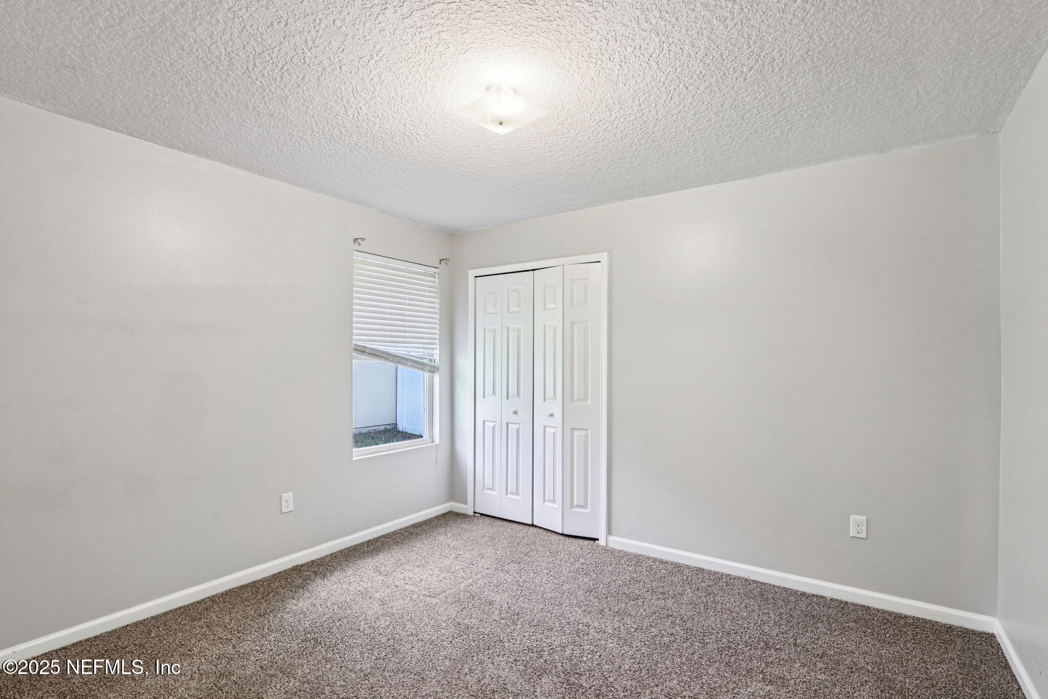 4054 Trail Ridge Road Middleburg, FL 32068 - Photo 24 of 48 an empty room with windows and closet