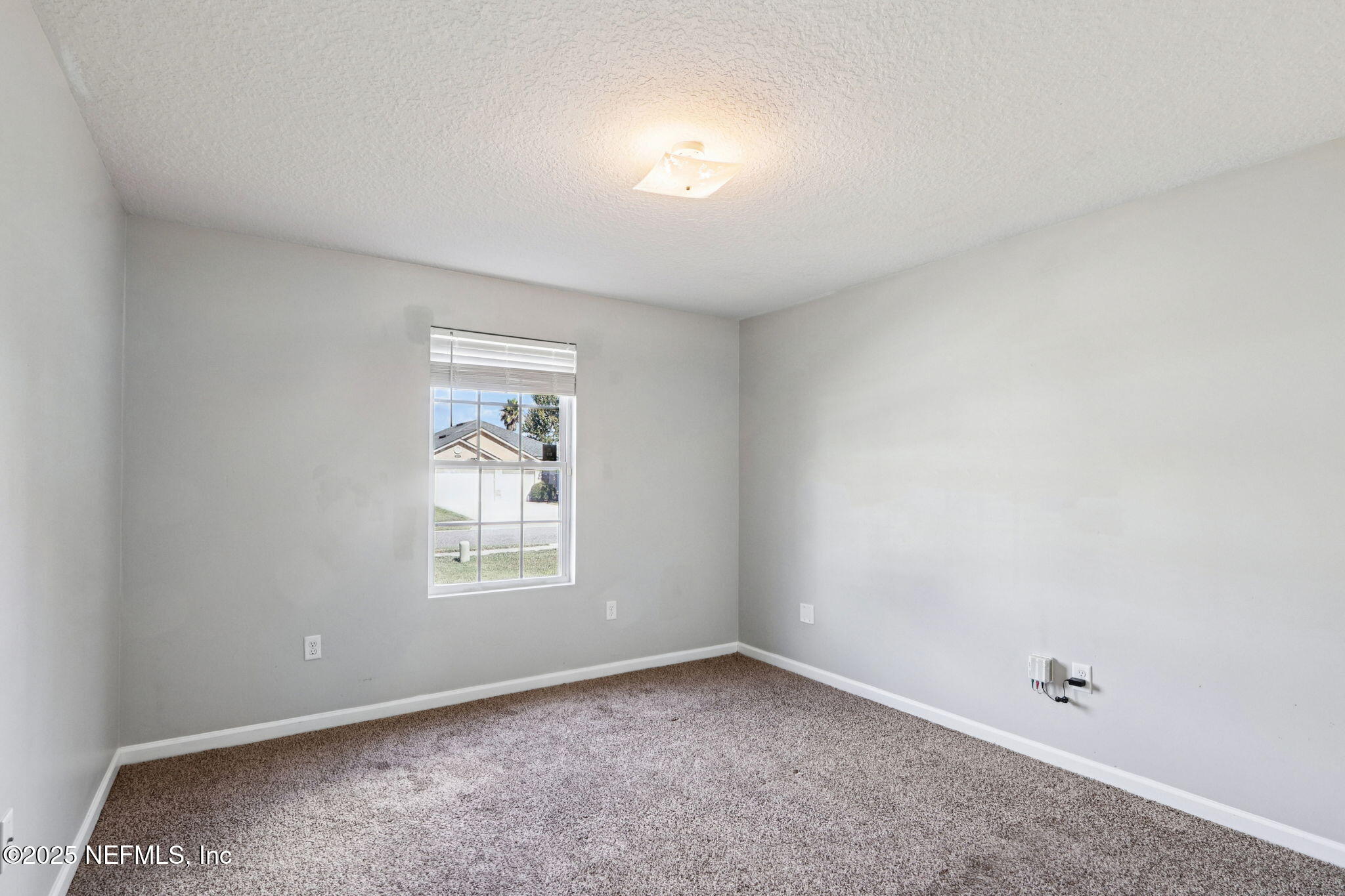 4054 Trail Ridge Road Middleburg, FL 32068 - Photo 27 of 48 an empty room with a window