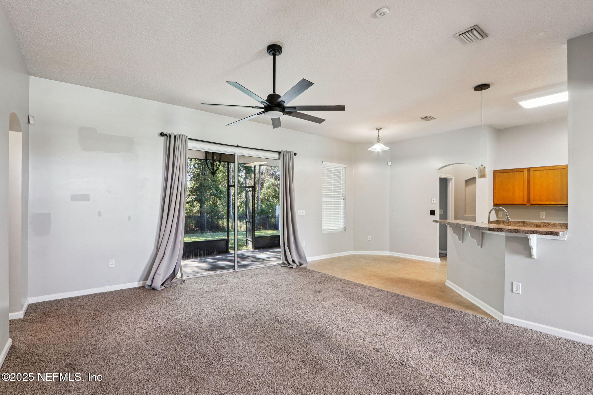 4054 Trail Ridge Road Middleburg, FL 32068 - Photo 45 of 48 a view of an empty room with window and a kitchen