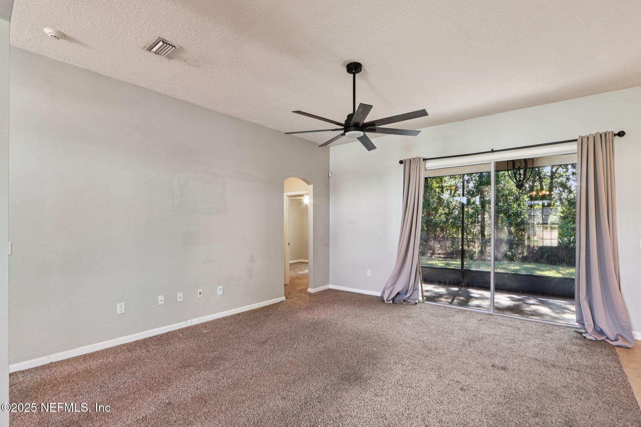 4054 Trail Ridge Road Middleburg, FL 32068 - Photo 5 of 48 a view of a livingroom with a ceiling fan and window