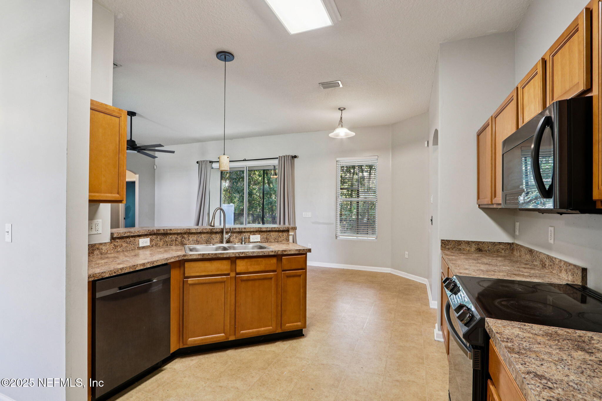 4054 Trail Ridge Road Middleburg, FL 32068 - Photo 6 of 48 a kitchen with a sink stove and cabinets