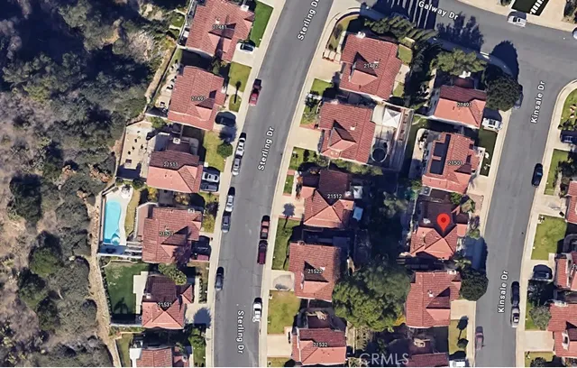 an aerial view of multi story residential apartment building with yard