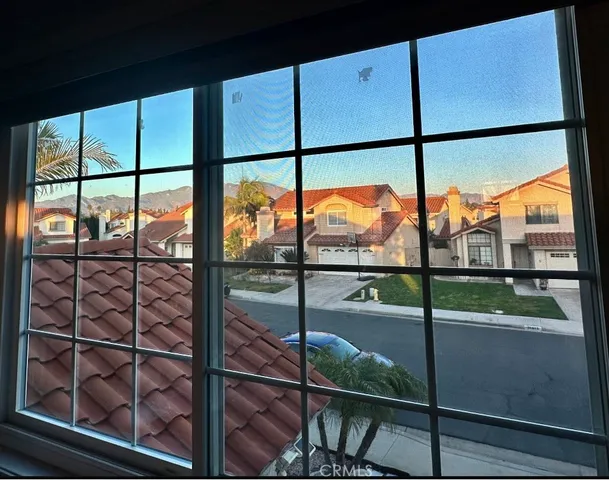 a kitchen with stainless steel appliances a table chairs and a refrigerator