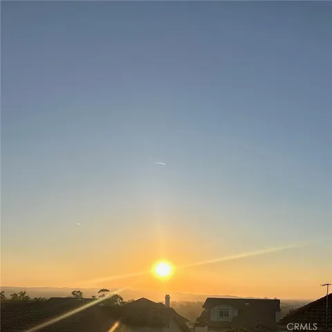 a living room with fireplace furniture and a large window