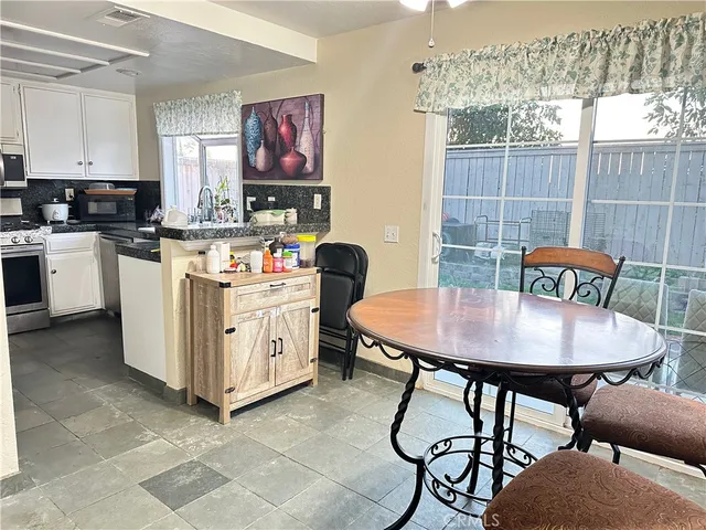 a living room with furniture and a mirror