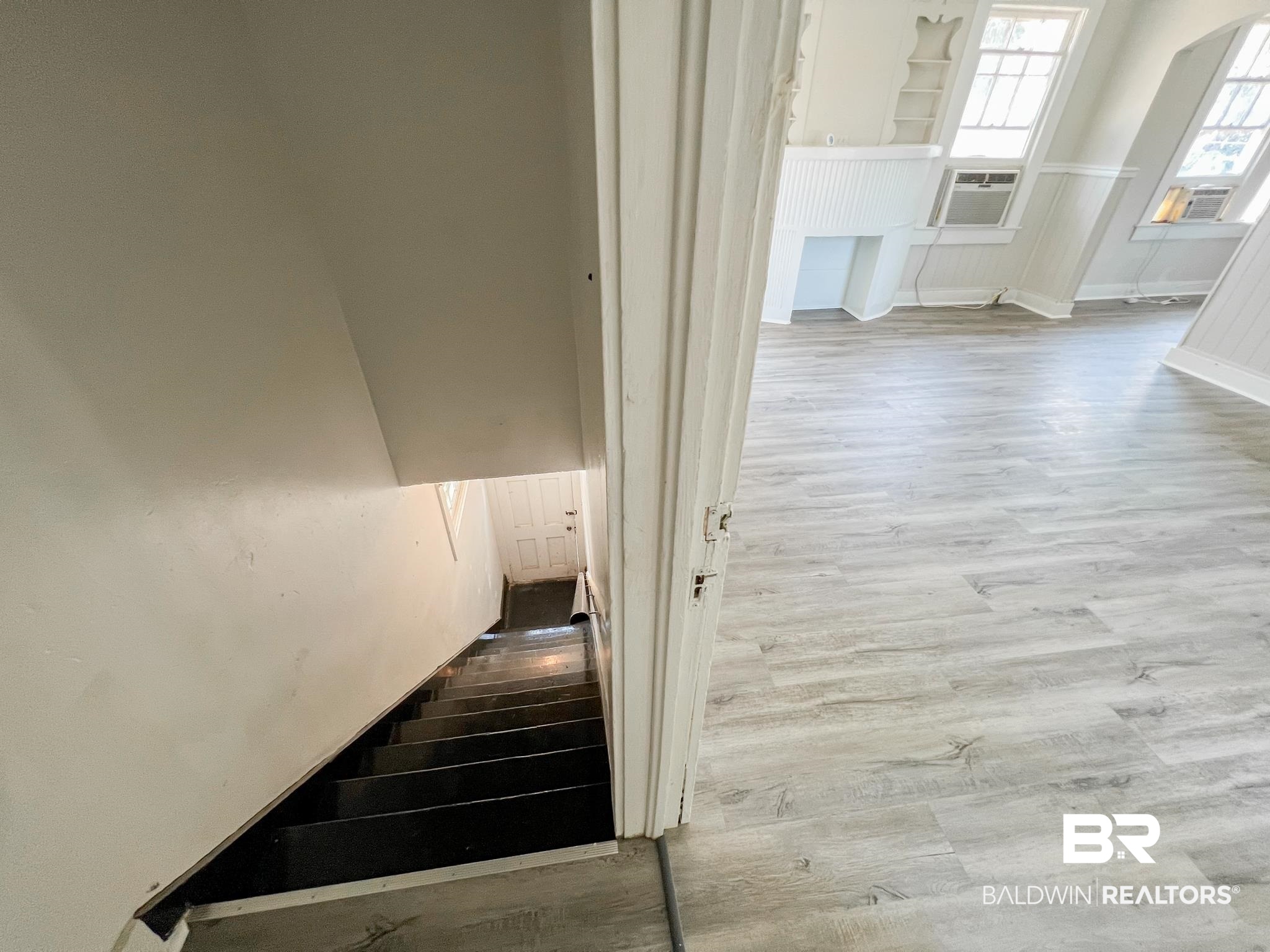 5 North Fulton Street Mobile, AL 36607 - Photo 16 of 55 Staircase with cooling unit and hardwood / wood-style flooring