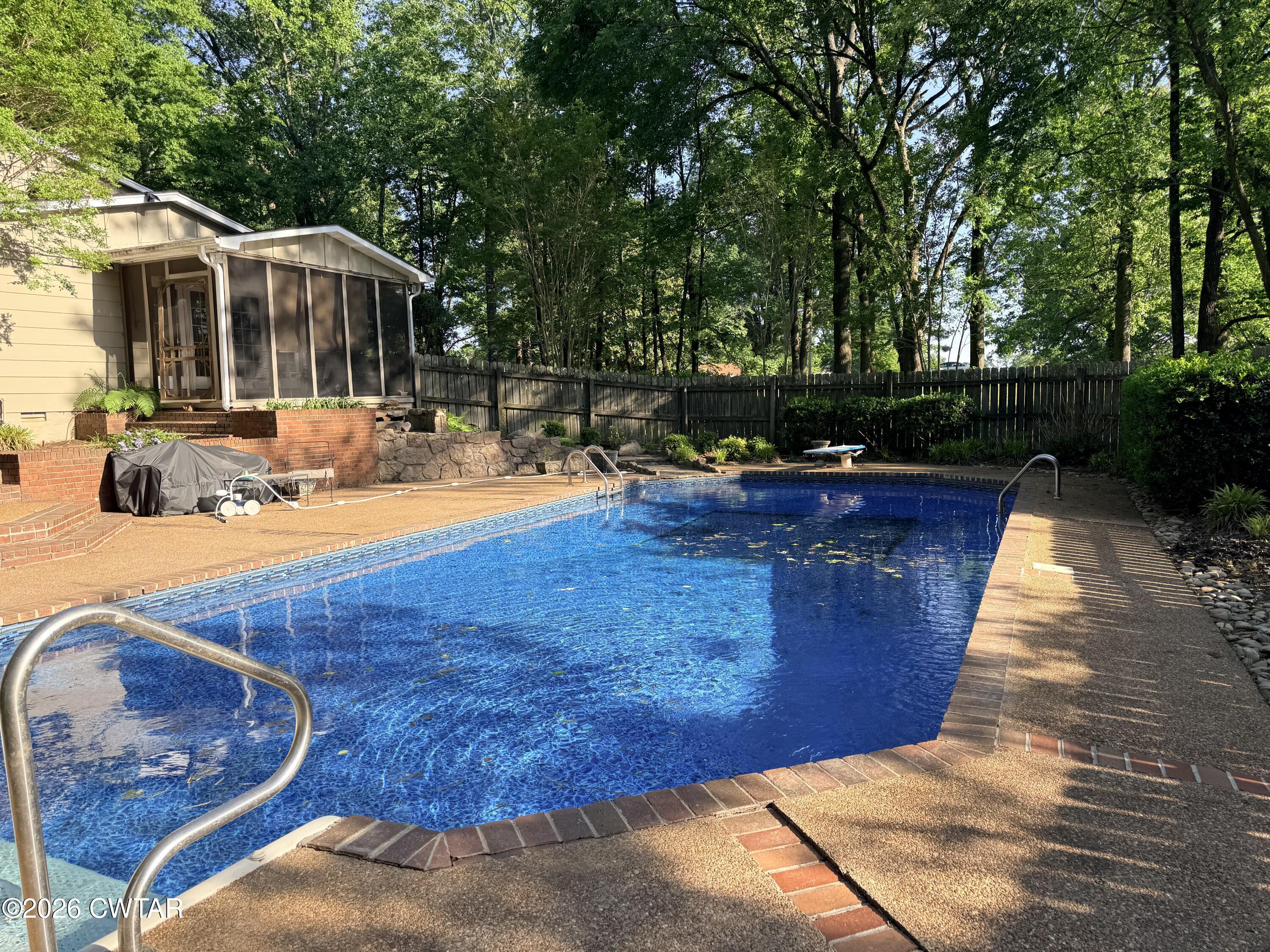 261 Lackey Lane Ripley, TN 38063 - Photo 47 of 48 a view of a swimming pool with a patio
