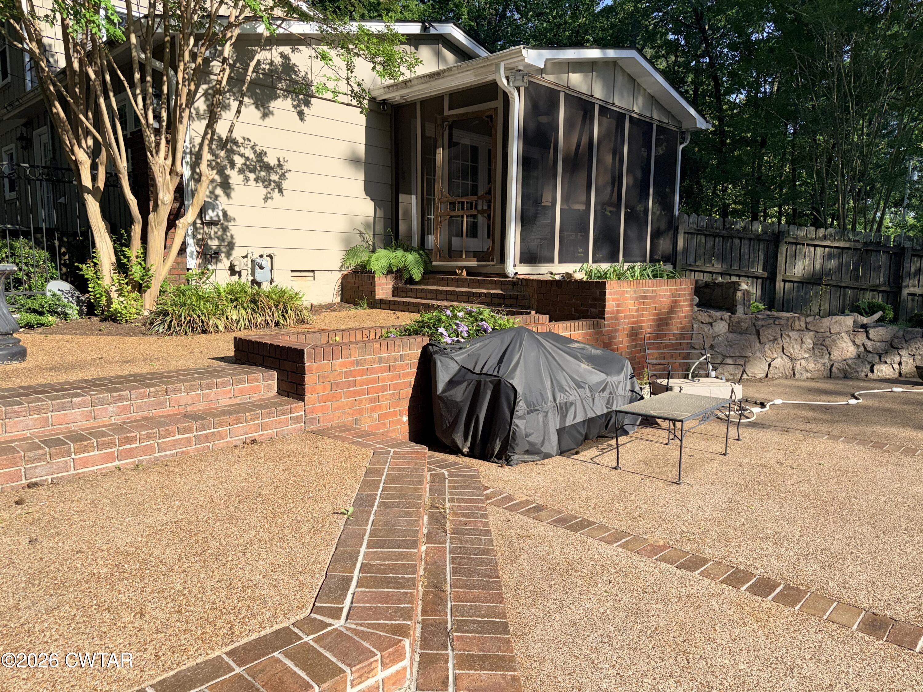261 Lackey Lane Ripley, TN 38063 - Photo 48 of 48 a view of outdoor space yard deck patio and fire pit