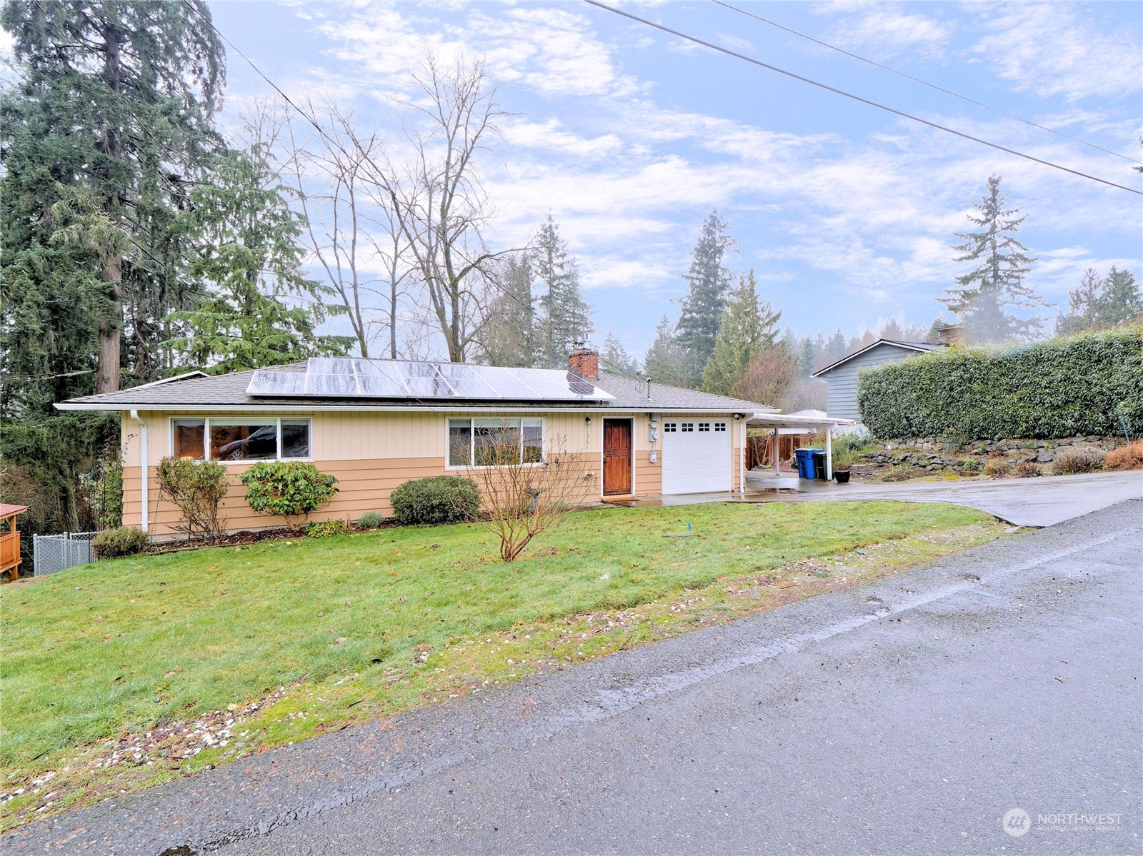 11261 145th Avenue Southeast Renton, WA 98059 - Photo 1 of 26 a view of a house with a yard and a large tree