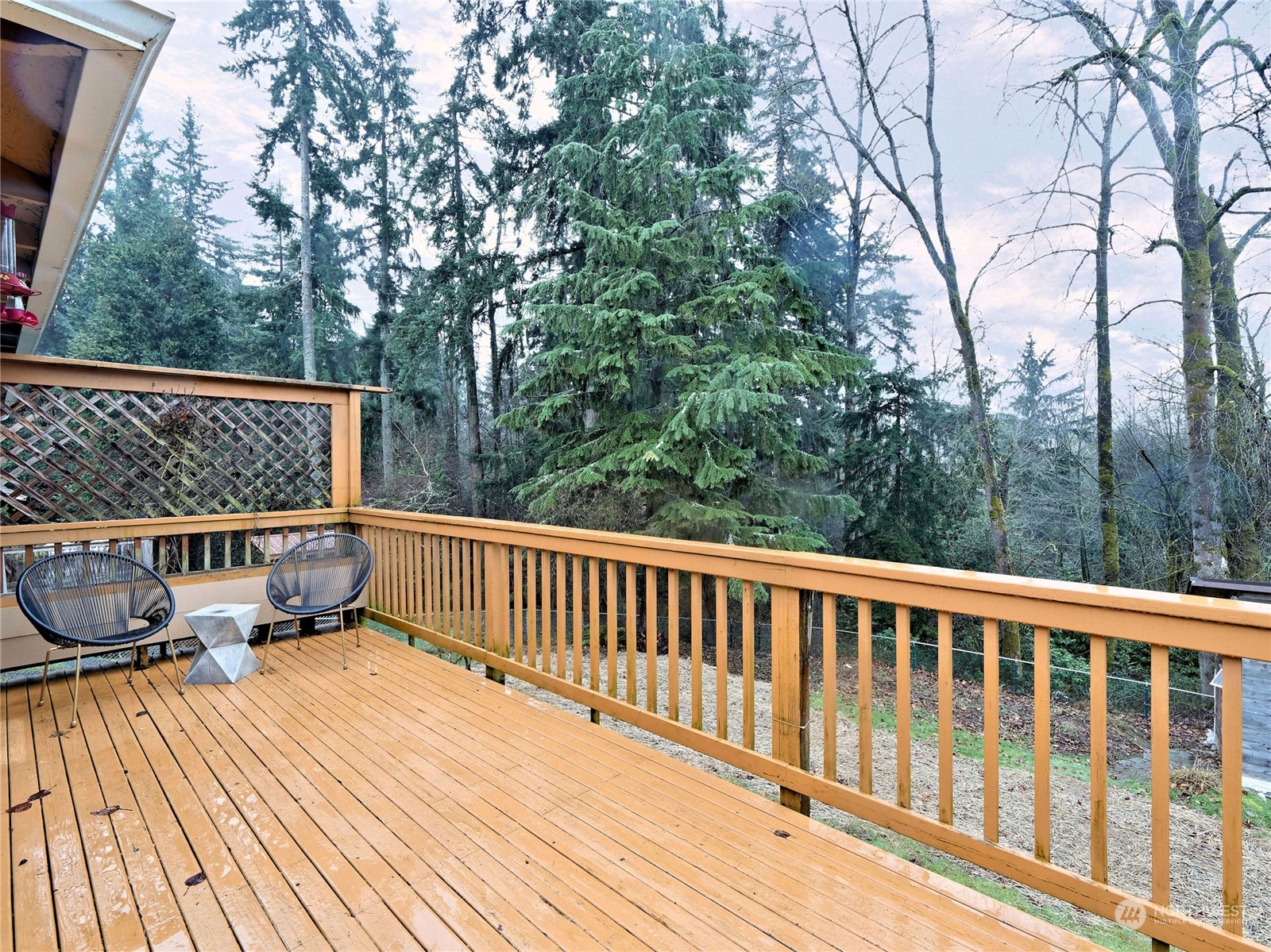 11261 145th Avenue Southeast Renton, WA 98059 - Photo 12 of 26 a view of balcony with wooden floor and outdoor seating