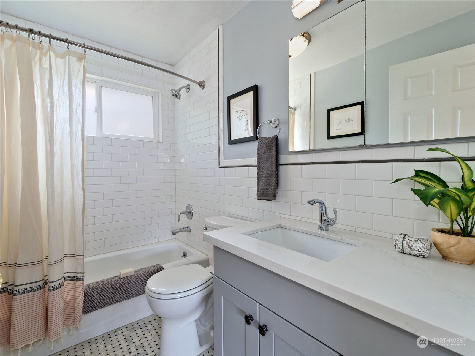 11261 145th Avenue Southeast Renton, WA 98059 - Photo 13 of 26 a bathroom with a sink a toilet and shower