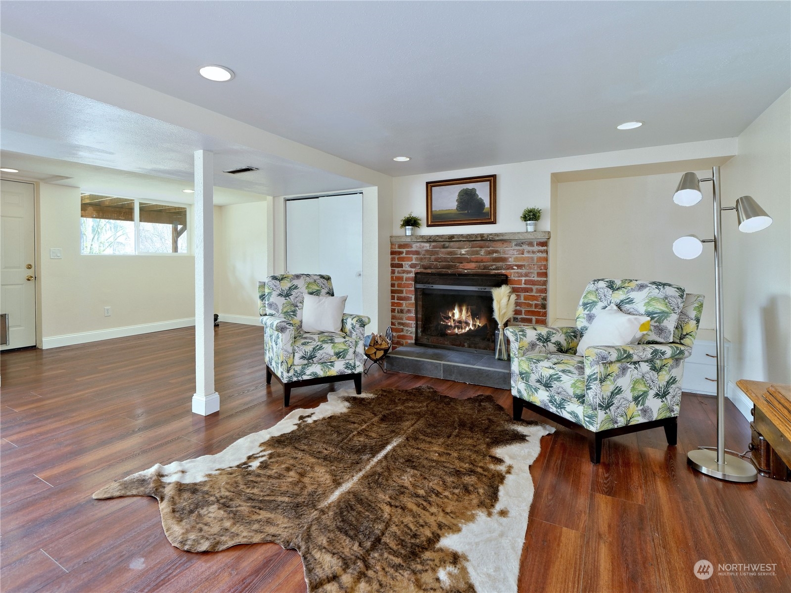 11261 145th Avenue Southeast Renton, WA 98059 - Photo 17 of 26 a living room with furniture and a fireplace