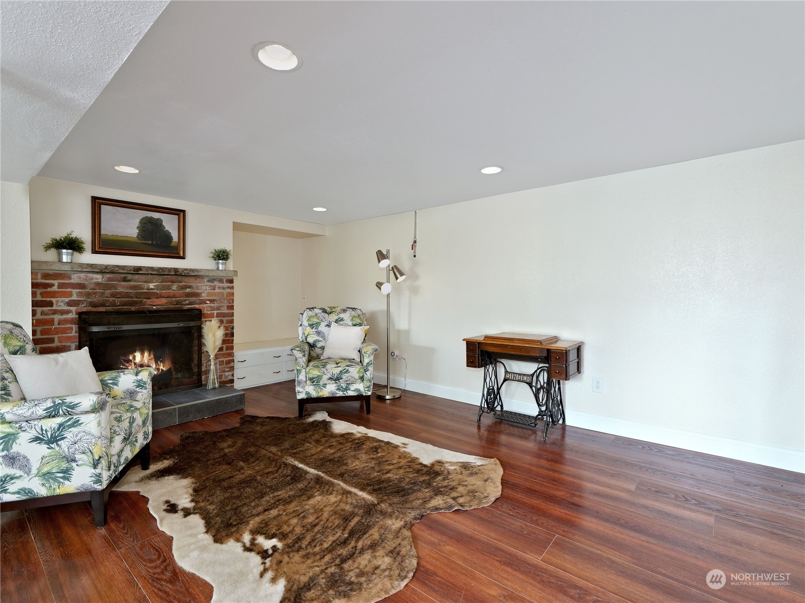11261 145th Avenue Southeast Renton, WA 98059 - Photo 18 of 26 a living room with furniture and a fireplace
