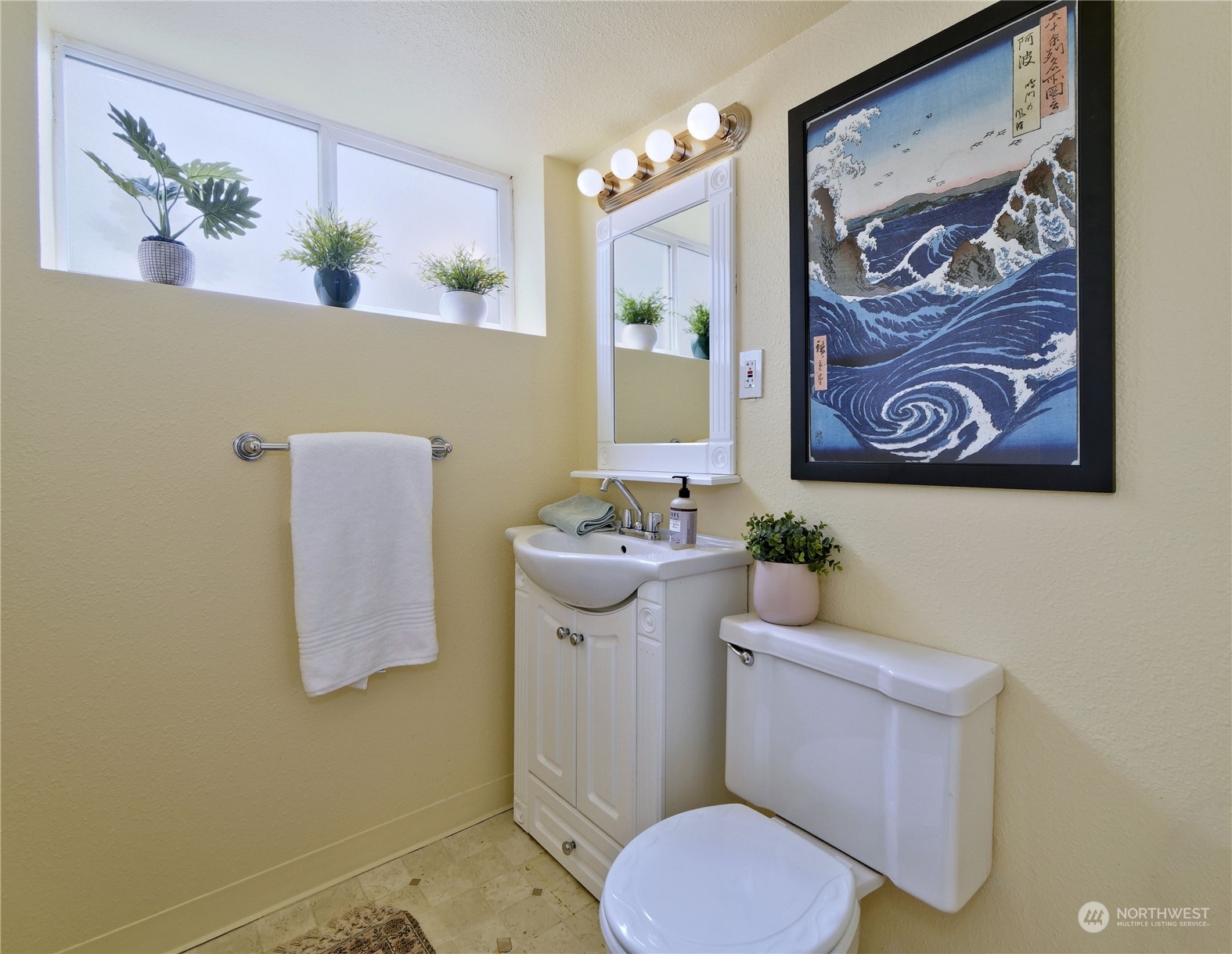 11261 145th Avenue Southeast Renton, WA 98059 - Photo 20 of 26 a white toilet sitting next to a bathroom sink