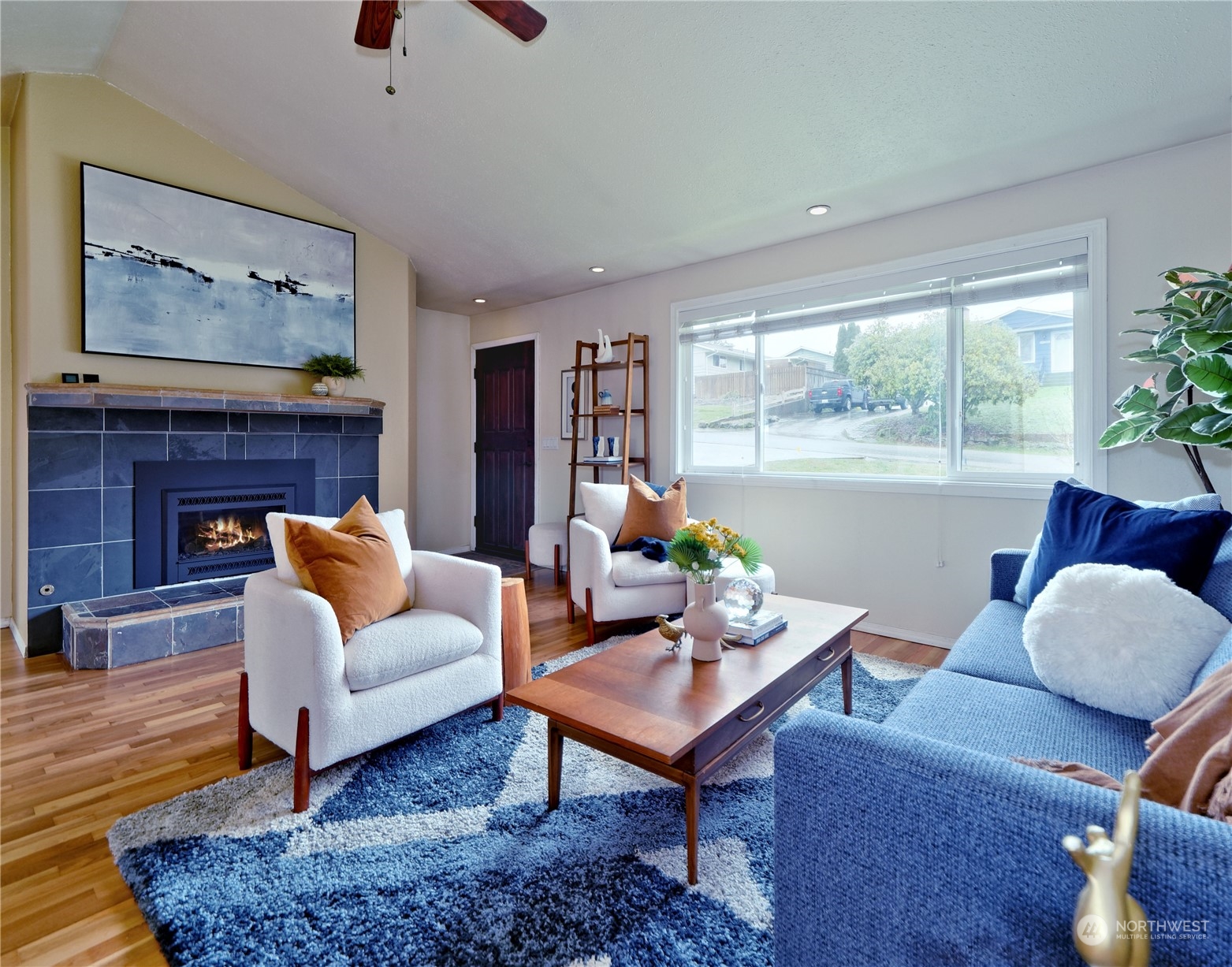 11261 145th Avenue Southeast Renton, WA 98059 - Photo 2 of 26 a living room with furniture and a potted plant