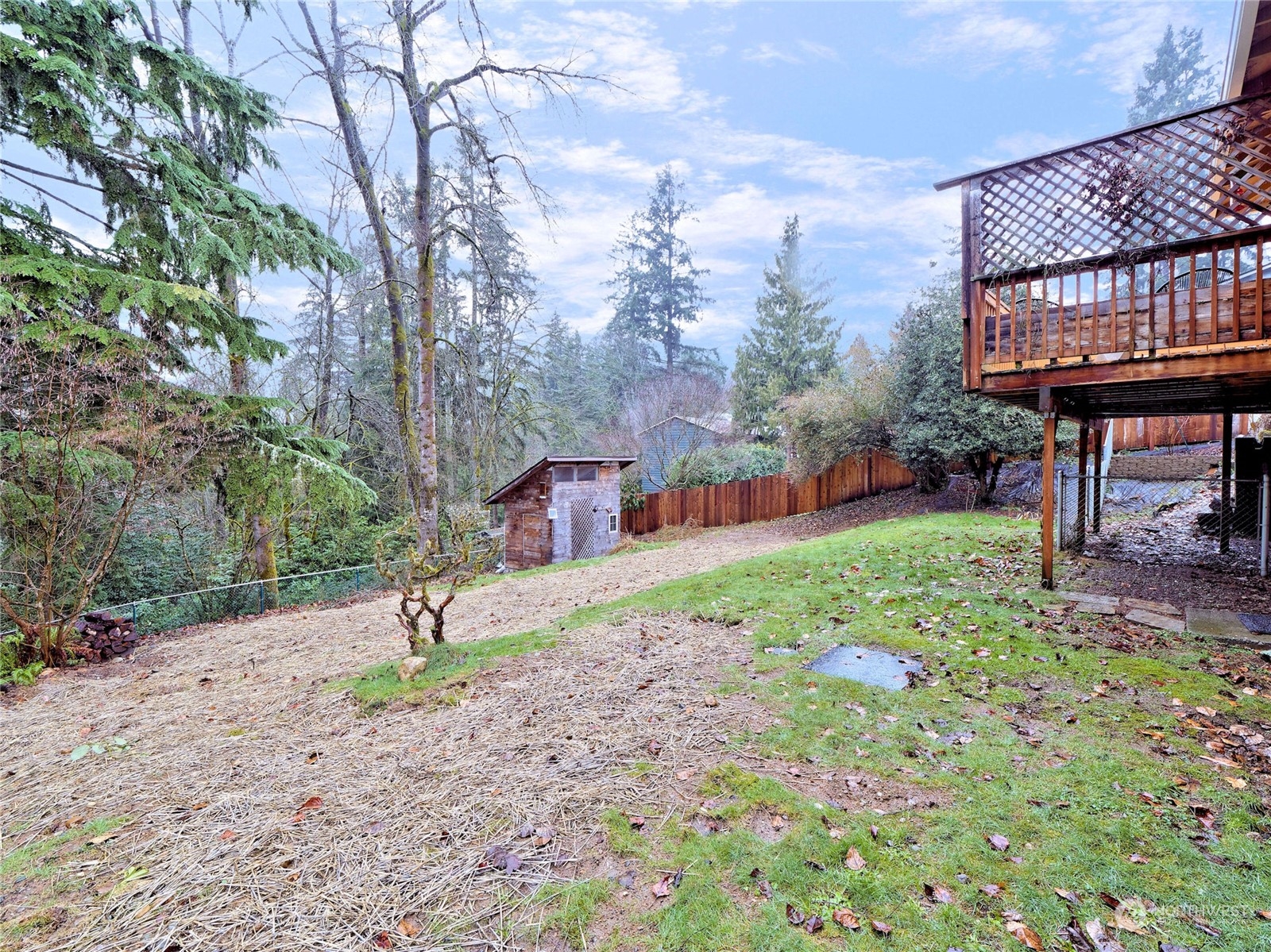 11261 145th Avenue Southeast Renton, WA 98059 - Photo 22 of 26 a backyard of a house with barbeque oven table and chairs