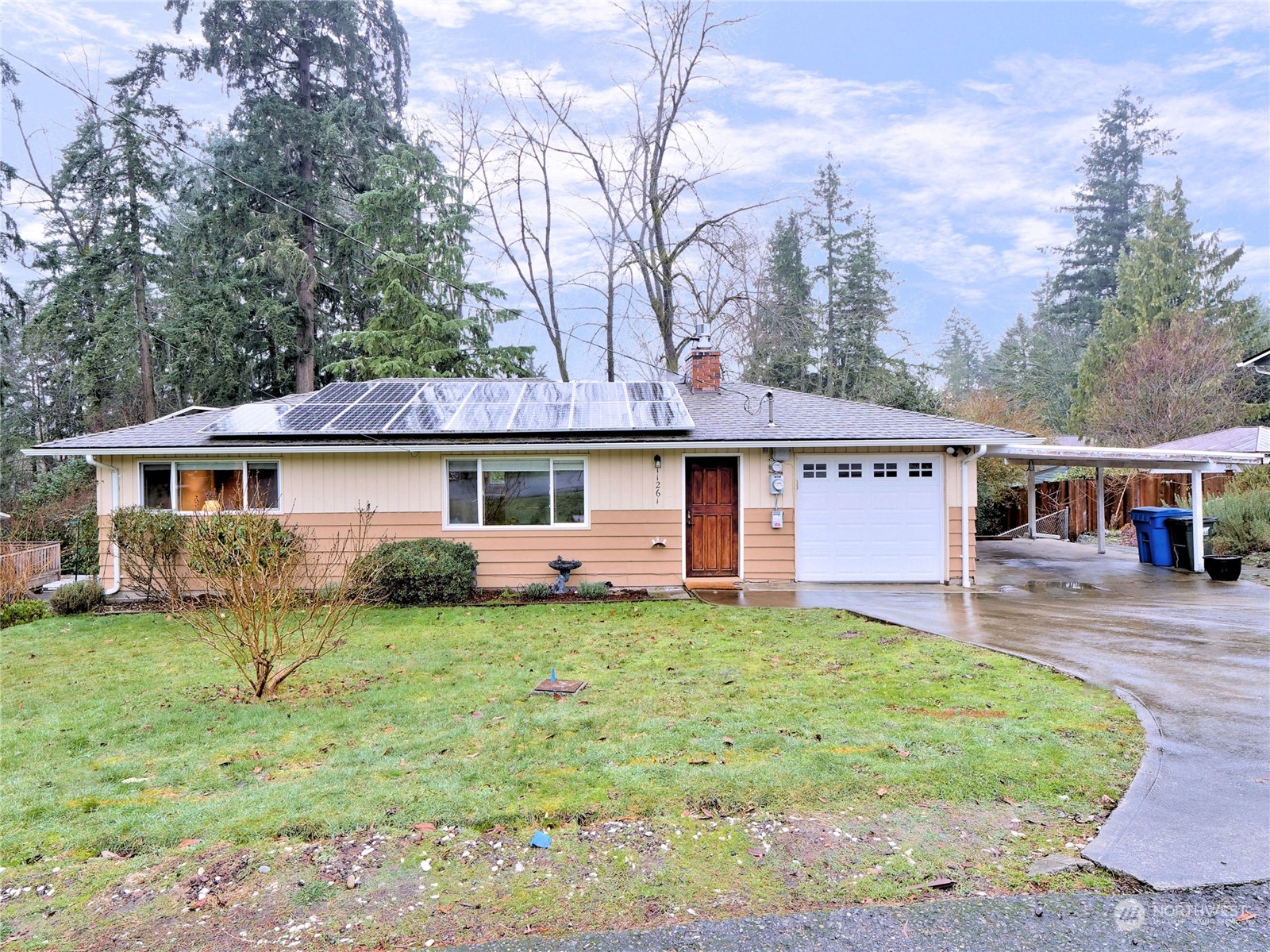 11261 145th Avenue Southeast Renton, WA 98059 - Photo 25 of 26 a front view of a house with a yard and trees