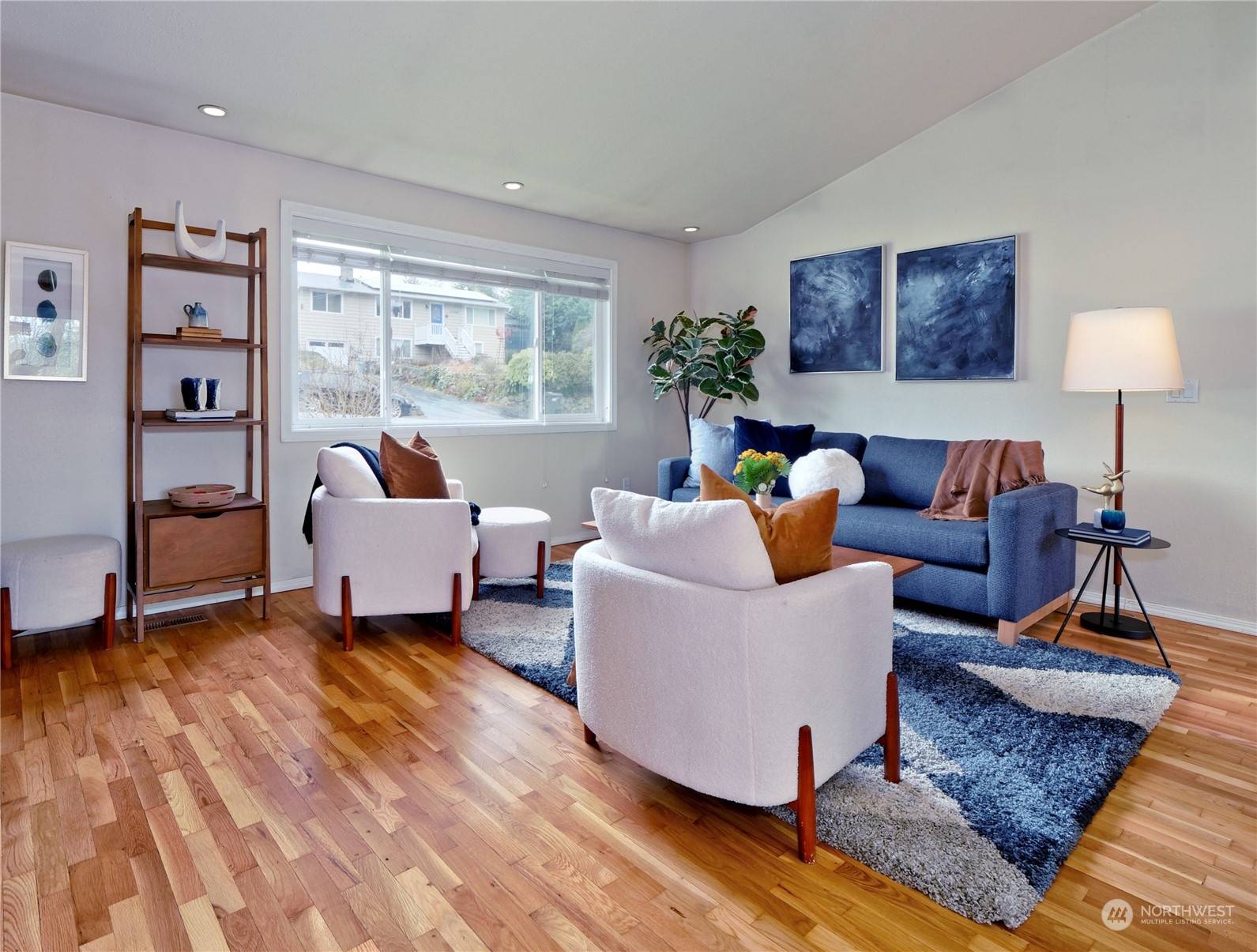 11261 145th Avenue Southeast Renton, WA 98059 - Photo 4 of 26 a living room with furniture and a wooden floor
