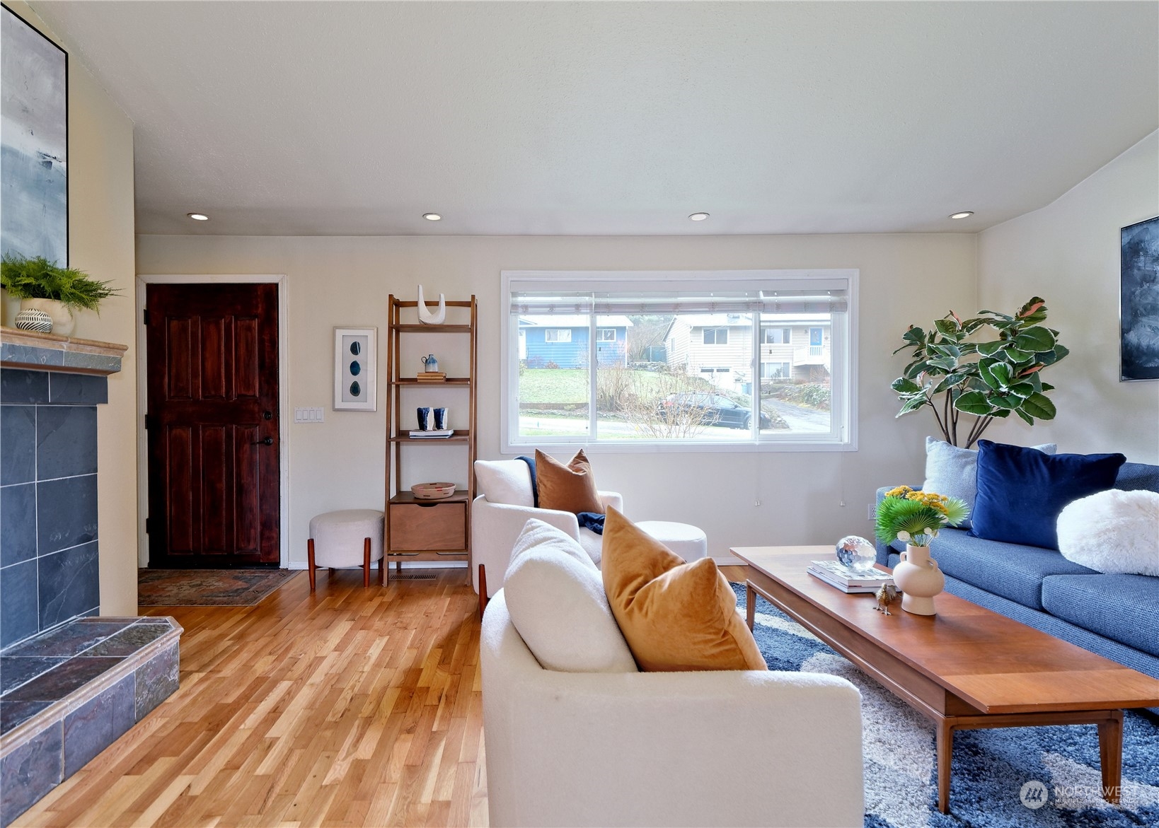 11261 145th Avenue Southeast Renton, WA 98059 - Photo 5 of 26 a living room with furniture and a potted plant