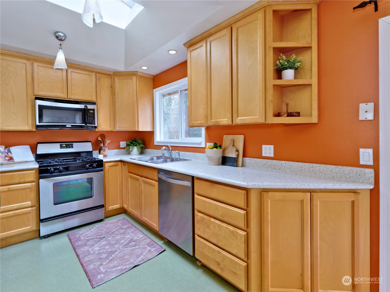 11261 145th Avenue Southeast Renton, WA 98059 - Photo 8 of 26 a kitchen with stainless steel appliances granite countertop a sink stove and cabinets