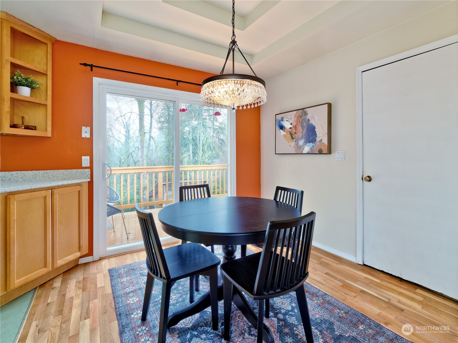 11261 145th Avenue Southeast Renton, WA 98059 - Photo 10 of 26 a dining room with furniture a chandelier and wooden floor