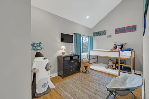 a bedroom with a bed and furniture