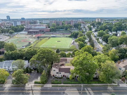 a front view of house with yard and green space