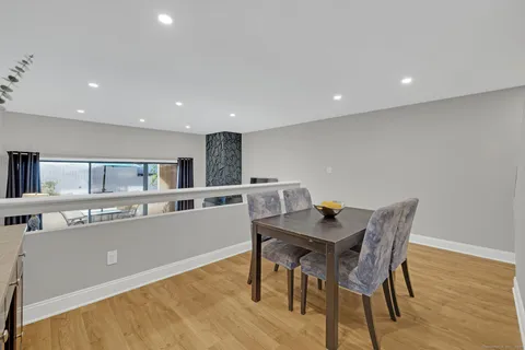 a kitchen with a table and chairs in it