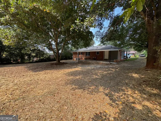 a view of a yard with a trees