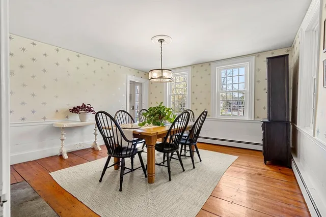 a dining room with furniture and window