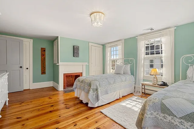 a spacious bedroom with a bed and a window