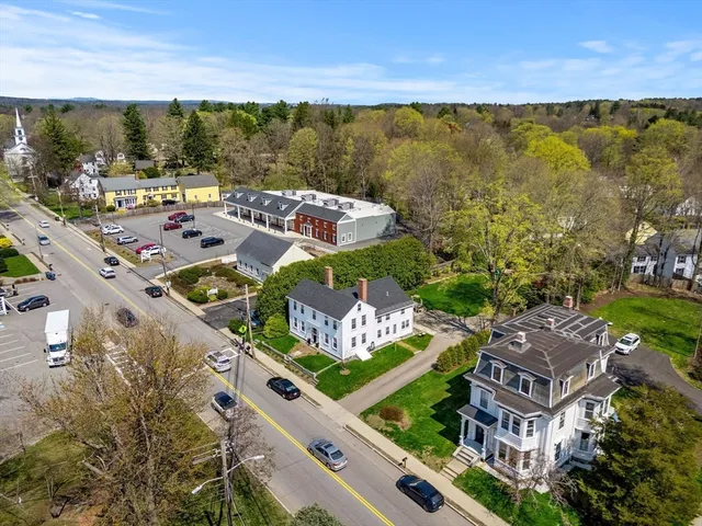 a bedroom with furniture and a fireplace