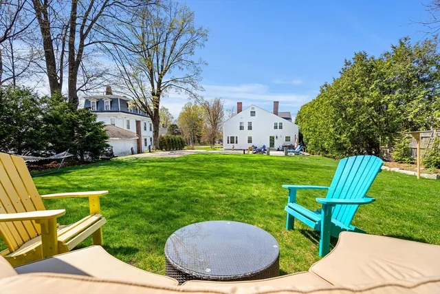 a view of a chair and table in the garden
