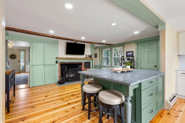 a room with furniture and a fireplace