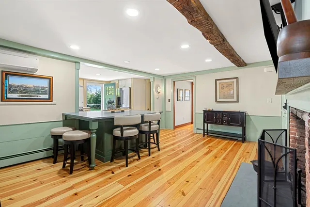 a view of a livingroom with furniture window and wooden floor