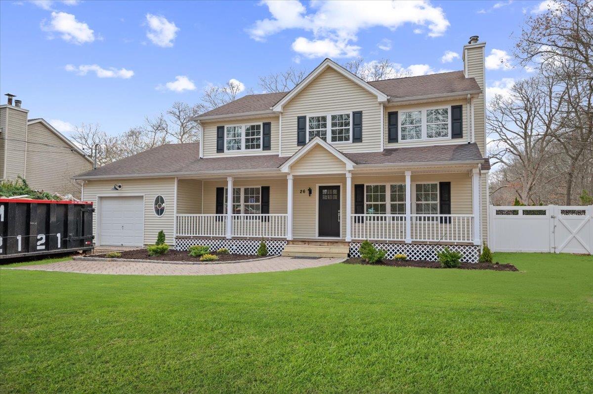 26 Riverhead Road Westhampton Beach, NY 11978 - Photo 1 of 1 a front view of a house with a yard and garage