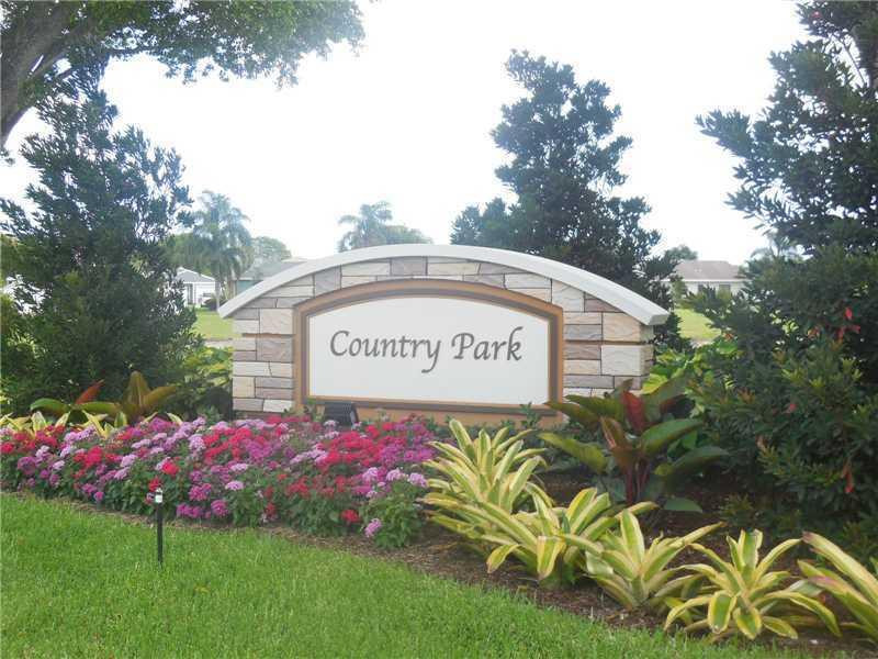 23279 New Coach Way Boca Raton, FL 33433 - Photo 12 of 16 a sign on the side of the road