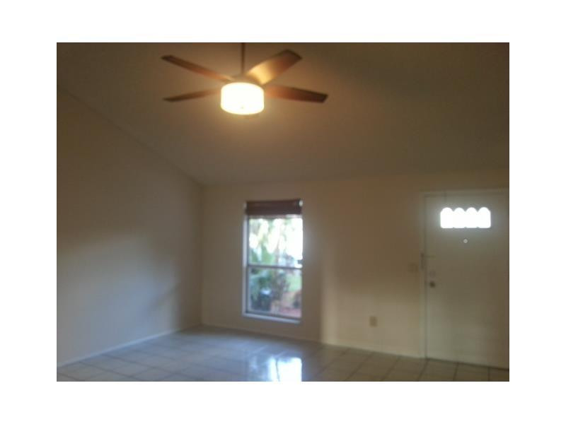 23279 New Coach Way Boca Raton, FL 33433 - Photo 3 of 16 a view of an empty room with a window