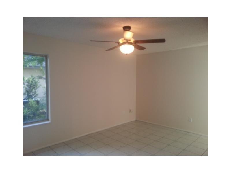 23279 New Coach Way Boca Raton, FL 33433 - Photo 6 of 16 a black and white kitchen with a window