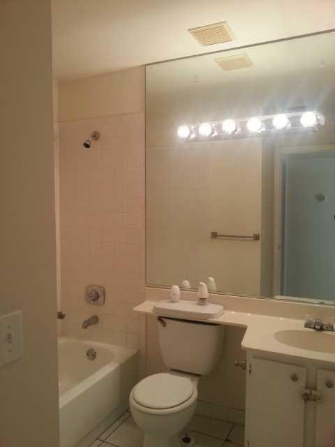 23279 New Coach Way Boca Raton, FL 33433 - Photo 8 of 16 a bathroom with a sink a toilet and shower