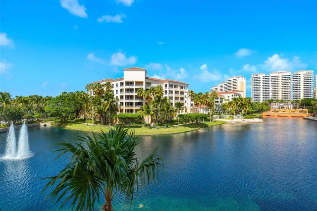 a view of a lake with a building in the background