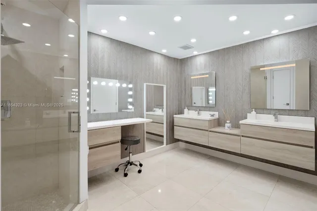 a bathroom with a double vanity sink and mirror