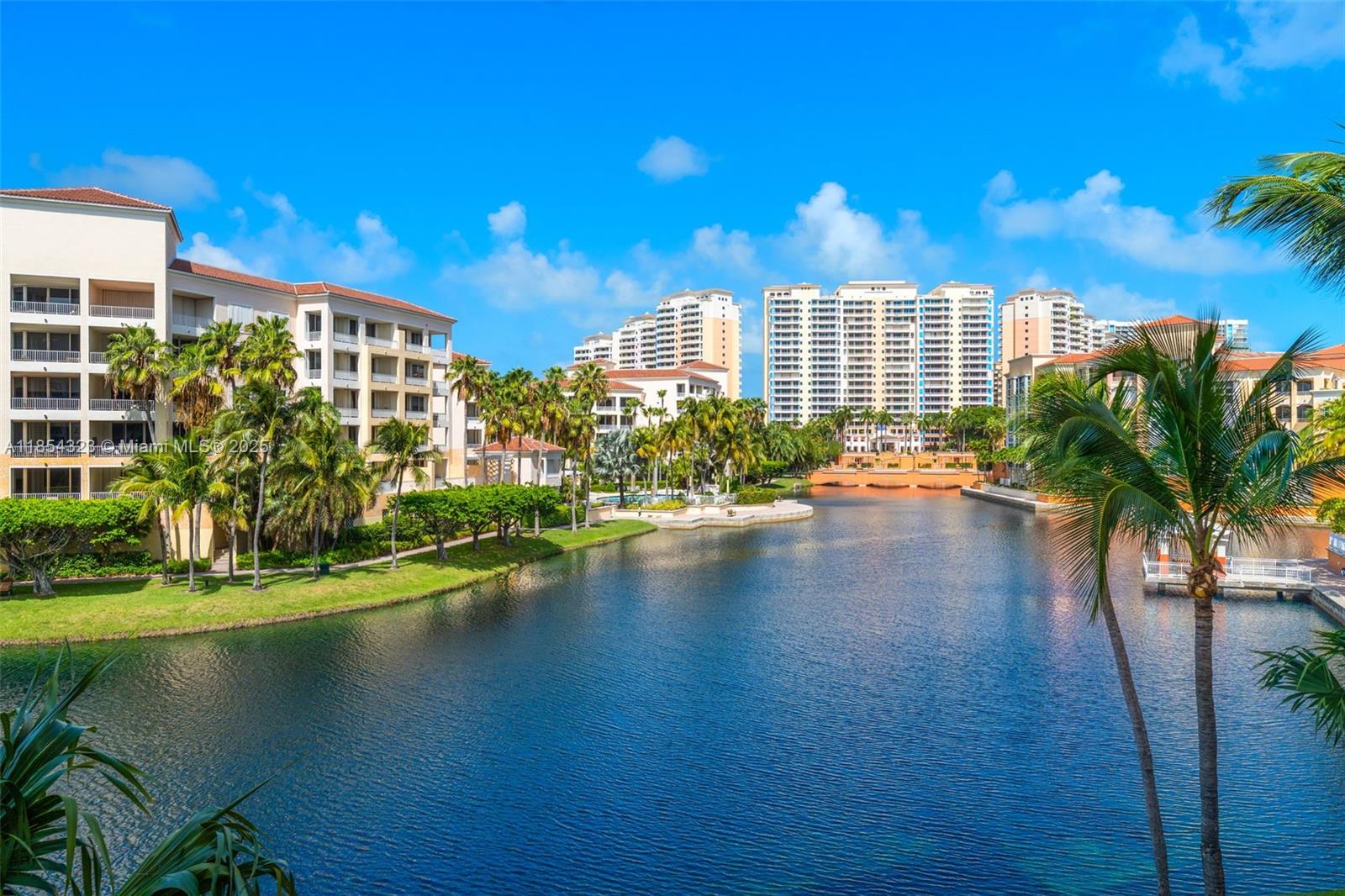 723 Crandon Boulevard, Unit 305 Key Biscayne, FL 33149 - Photo 20 of 29 a view of building with garden space and swimming pool