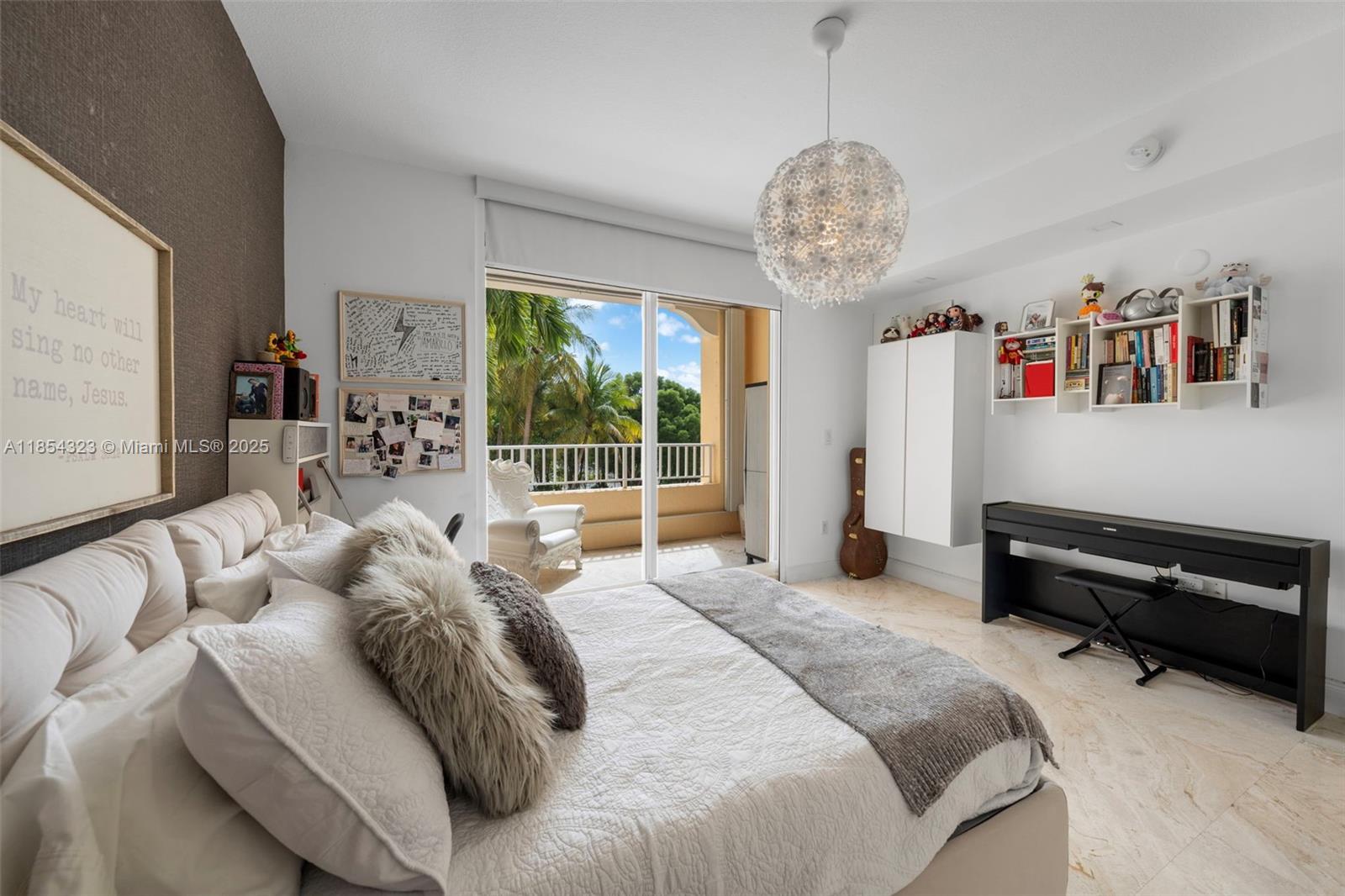 723 Crandon Boulevard, Unit 305 Key Biscayne, FL 33149 - Photo 23 of 29 a bedroom with a bed and a large window