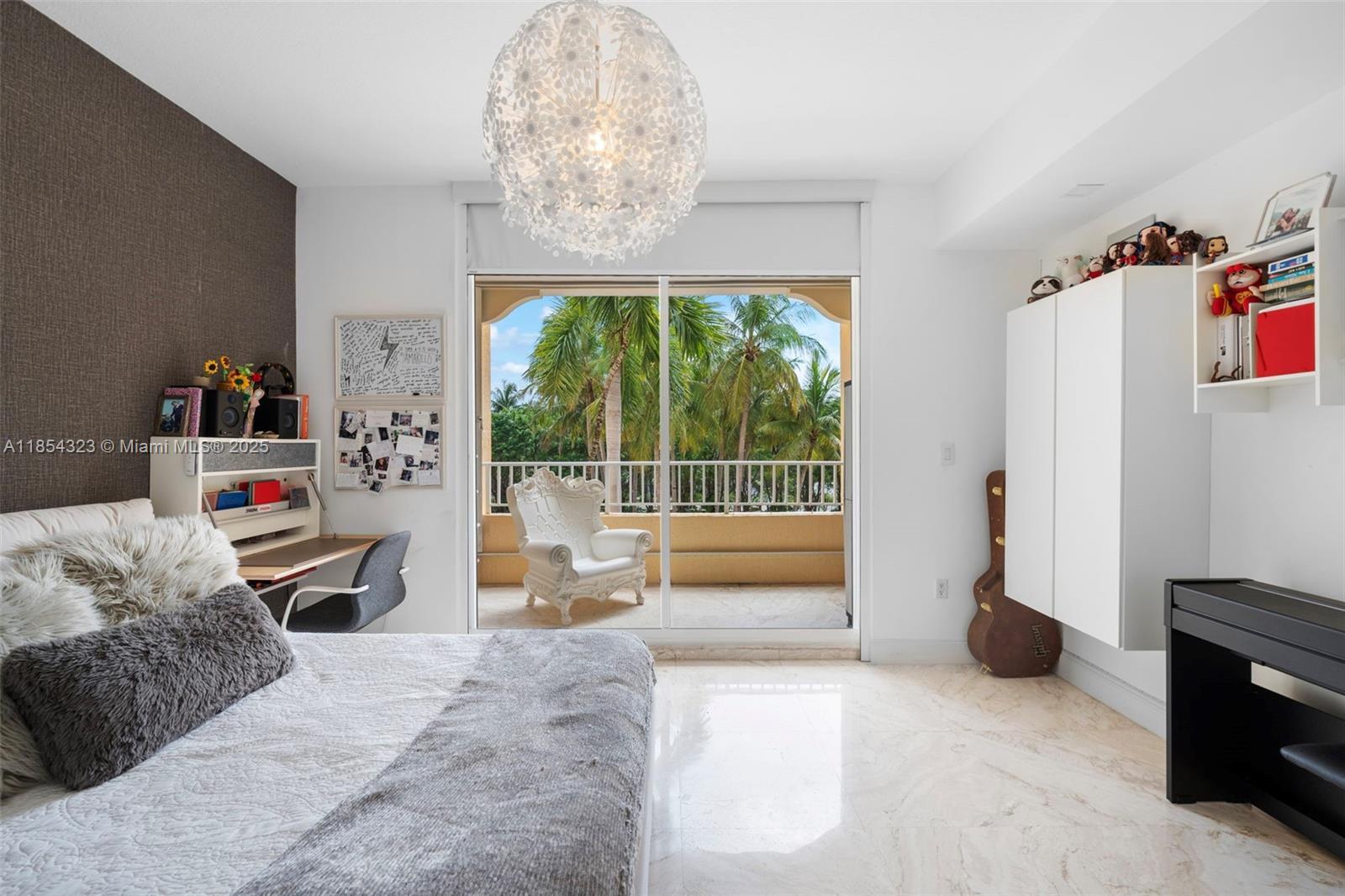 723 Crandon Boulevard, Unit 305 Key Biscayne, FL 33149 - Photo 24 of 29 a bedroom with furniture and a large window