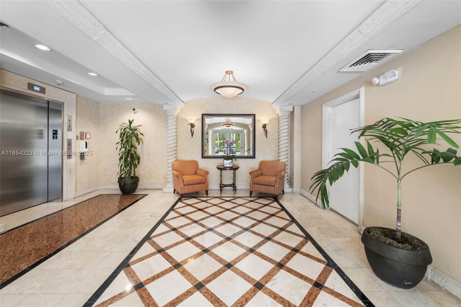 723 Crandon Boulevard, Unit 305 Key Biscayne, FL 33149 - Photo 3 of 29 a living room with furniture lamp and a potted plant