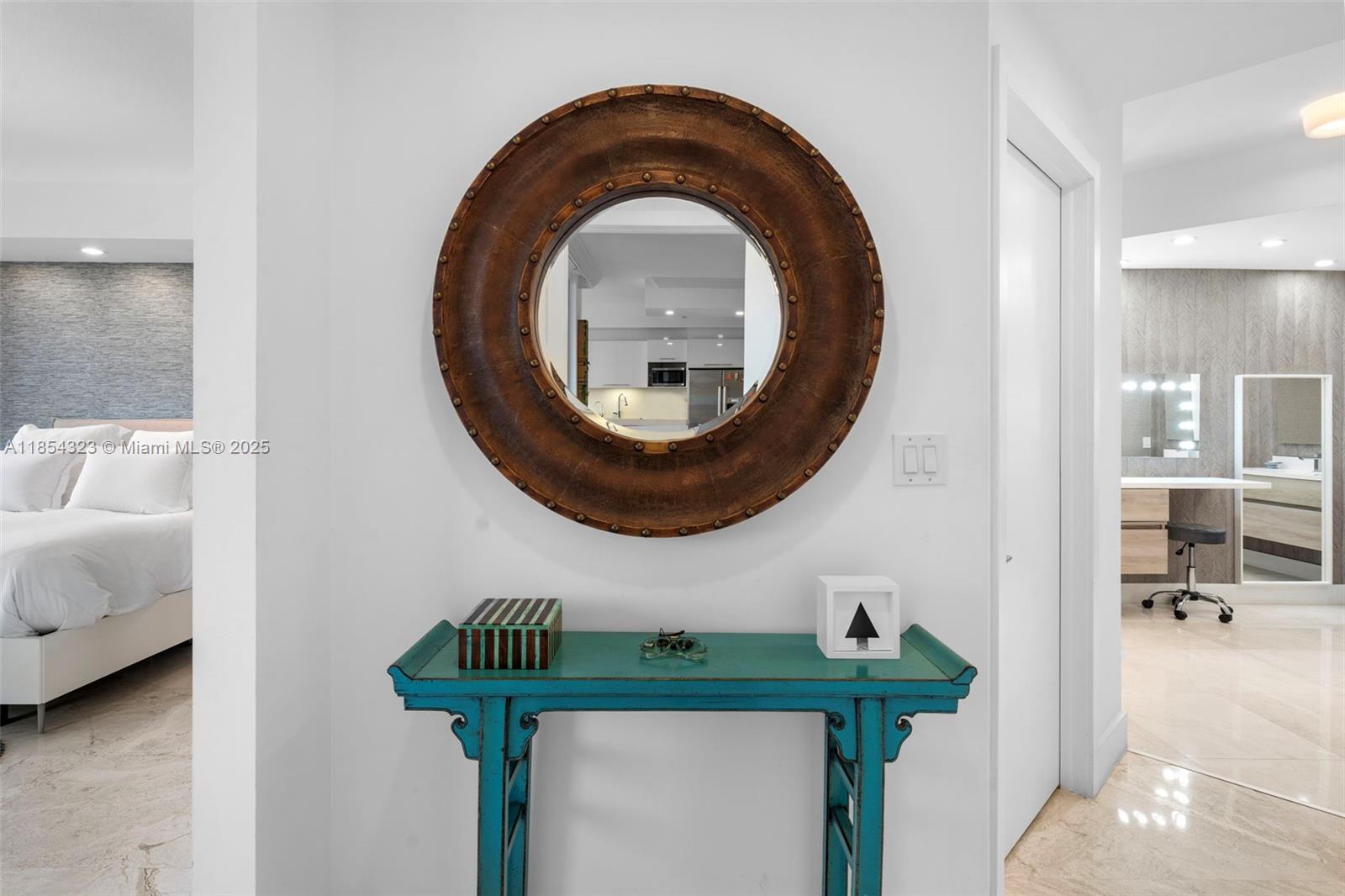 723 Crandon Boulevard, Unit 305 Key Biscayne, FL 33149 - Photo 10 of 29 a bathroom with a sink and a mirror