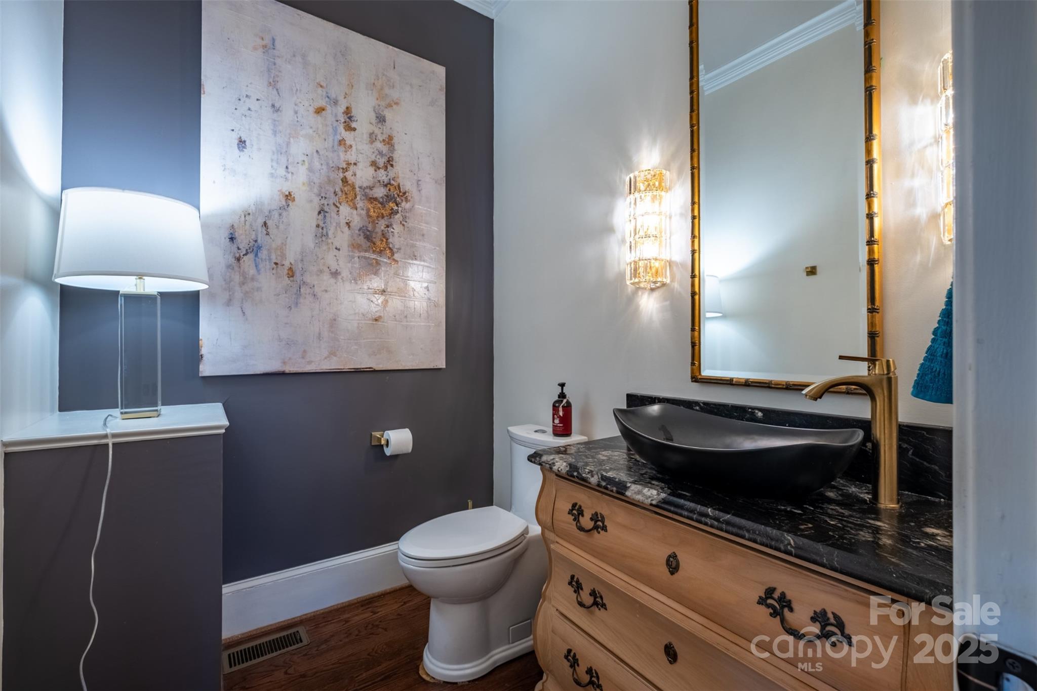 19002 Meta Road Cornelius, NC 28031 - Photo 15 of 48 a bathroom with a toilet sink and mirror