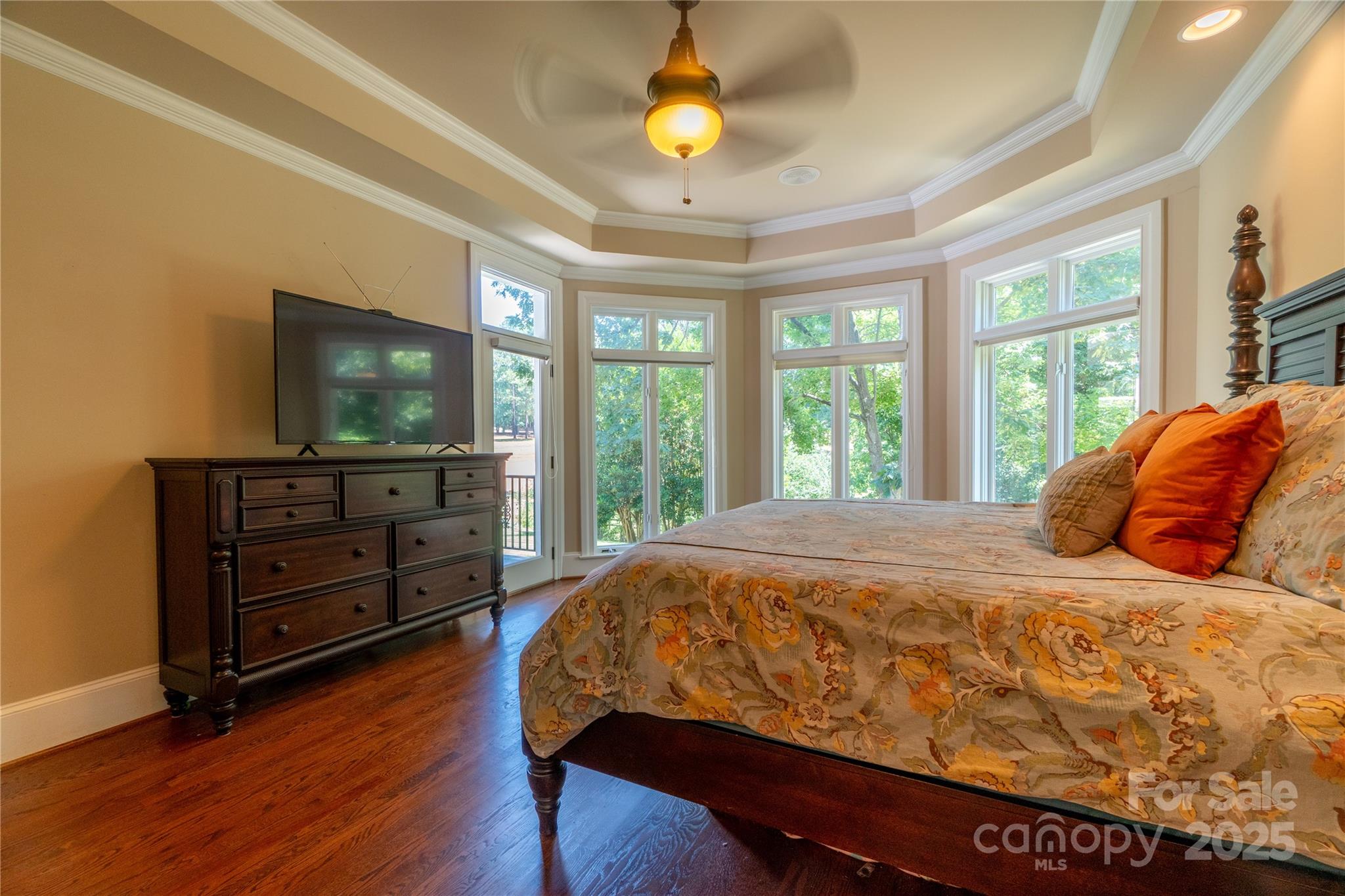 19002 Meta Road Cornelius, NC 28031 - Photo 20 of 48 a bedroom with a bed and a flat screen tv